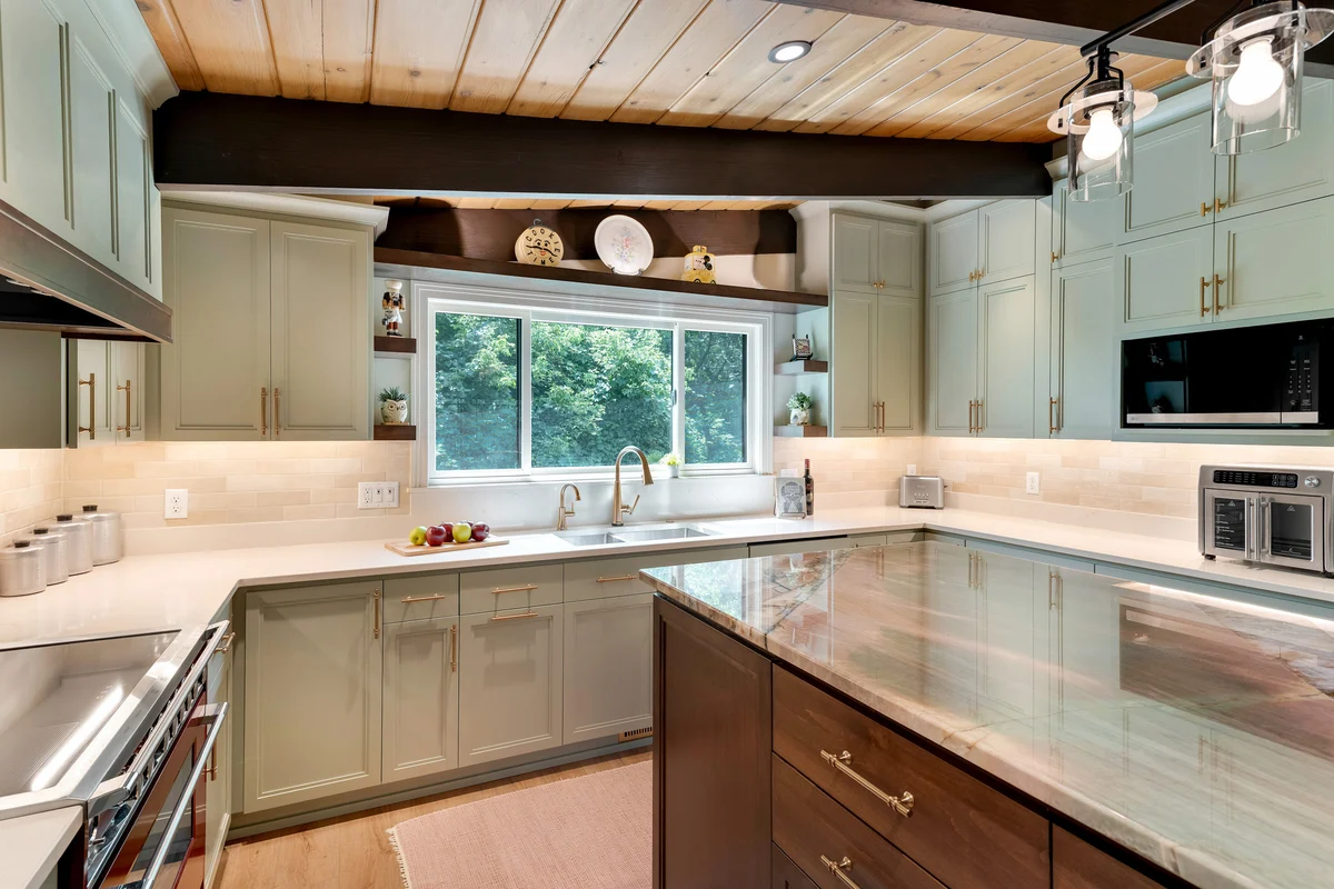 Completed kitchen remodel on 102nd Street East with island seating and a wood-plank ceiling
