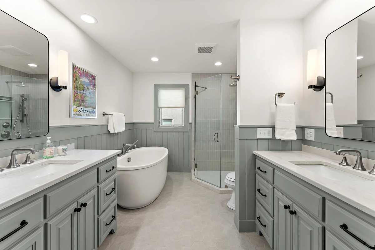 Bathroom remodel completed May 2026: freestanding tub, walk-in shower, brass fittings
